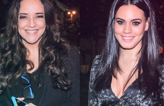 Ana Carolina e Leticia Lima são fotografadas de braços dados em aeroporto