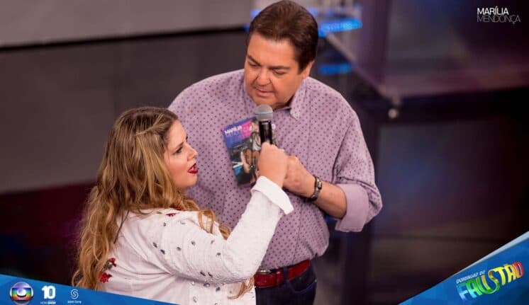 Após saia justa, Faustão diz que Marília Mendonça é "a vingança das gordinhas"