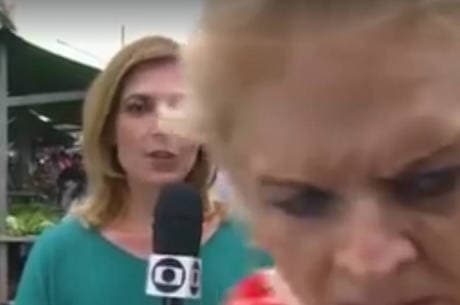 Senhora atrapalha Zelda Mello em reportagem ao vivo e vira assunto na internet