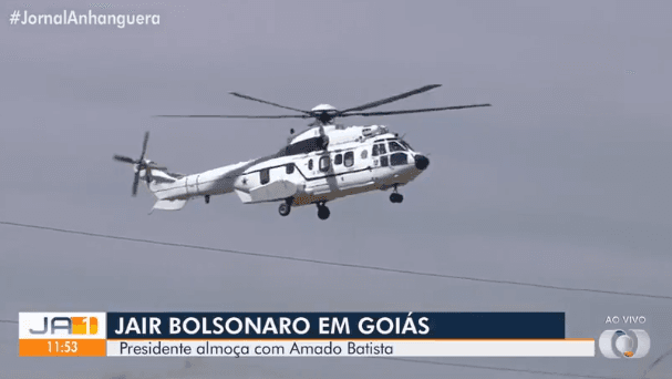 Um dos dois helicópteros mobilizados para Bolsonaro almoçar com Amado Batista (Foto: Reprodução/ TV Anhanguera/ Globo) Um dos dois helicópteros mobilizados para Bolsonaro almoçar com Amado Batista (Foto: Reprodução/ TV Anhanguera/ Globo)