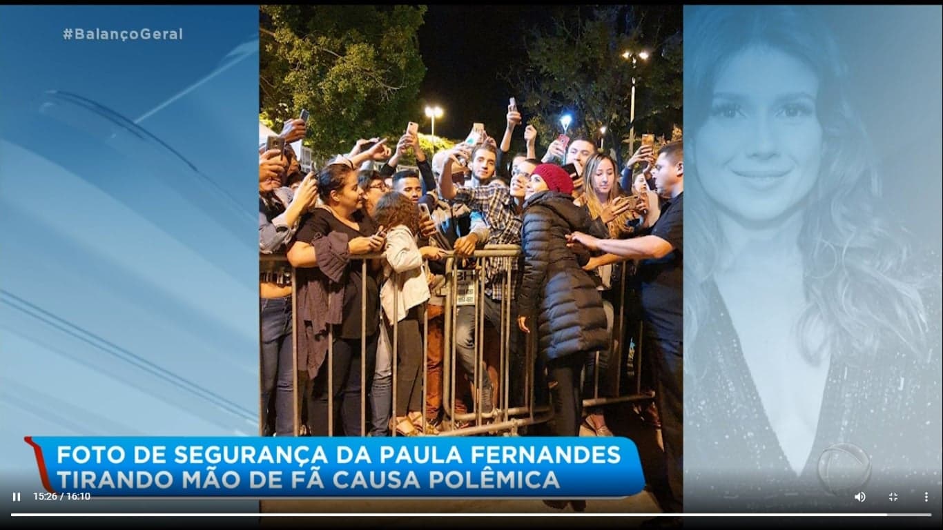 Paula Fernandes tem foto onde segurança tira braço de fã da cintura da cantora (Imagem: Reprodução) Paula Fernandes tem foto onde segurança tira braço de fã da cintura da cantora (Imagem: Reprodução)
