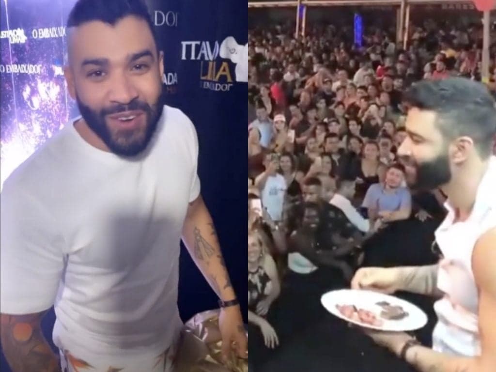 Gusttavo Lima desce do palco e oferece prato de linguiça para fãs durante show