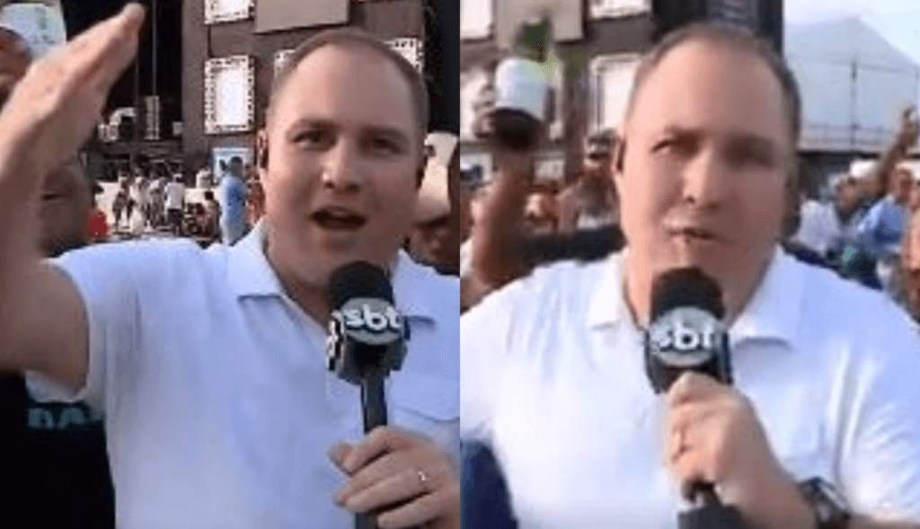 Jornalismo do SBT é invadido por multidão ao vivo, mulher toma microfone de repórter e dispara: "Falido"