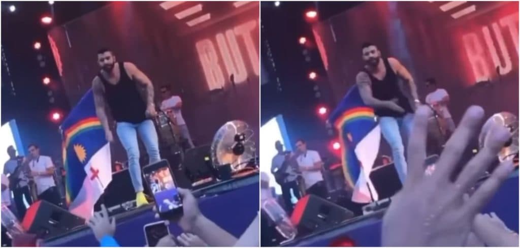 Eca! Gusttavo Lima tira objeto misterioso da boca e, todo babado, joga no público em show