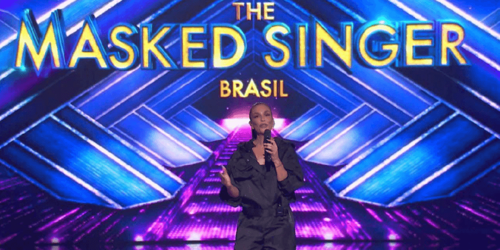 Colunista entrega primeiro nome do The Masked Singer e gera revolta de jornalista: "Vai tomar no seu c*"