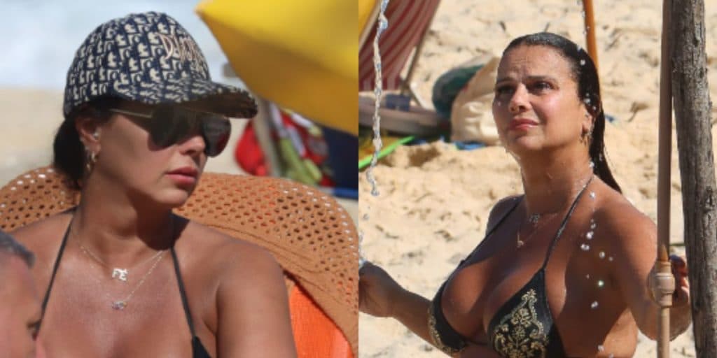 No oitavo mês da gravidez, Viviane Araújo é flagrada com barrigão estourando de biquíni na praia