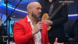 Belo foi convidado do Faustão na Band, mesma emissora que Denílson trabalha, com quem acumula divida alta