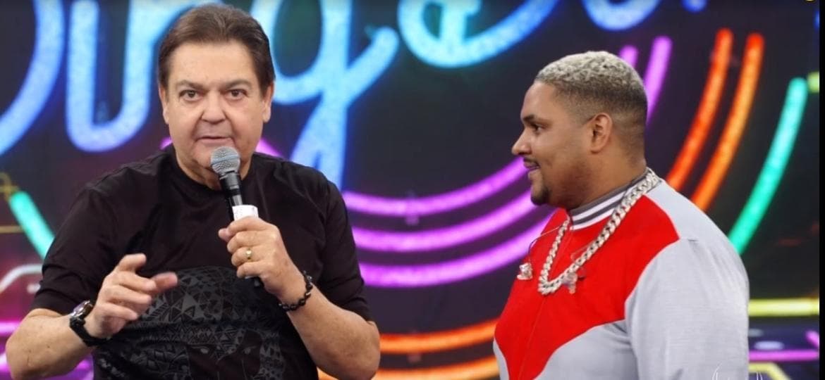 Faustão recebendo o funkeiro em seu programa no Domingão (Foto: reprodução / Globo) Faustão recebendo o funkeiro em seu programa no Domingão (Foto: reprodução / Globo)