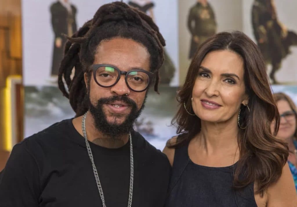 Cantor Rael ao lado de Fátima Bernardes durante uma participação no Encontro Cantor Rael ao lado de Fátima Bernardes durante uma participação no Encontro