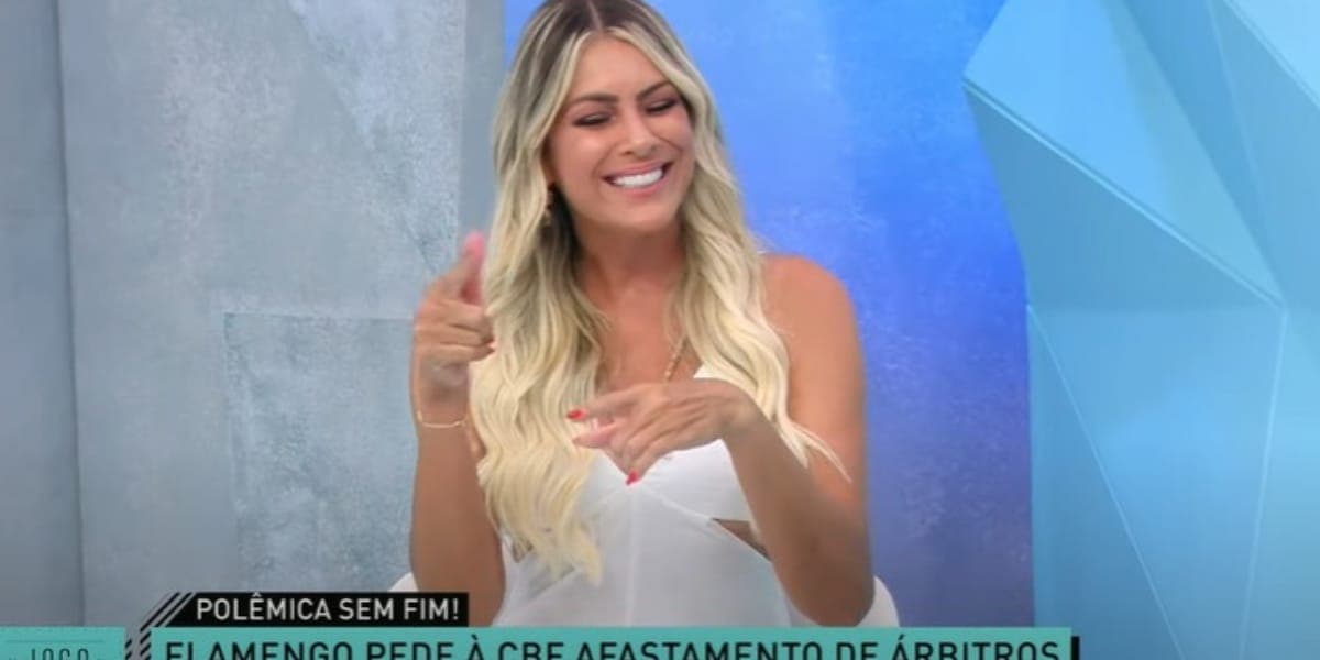 Renata Fan entrega que não sabe assoviar e gera risos de Denílson (Reprodução: Jogo Aberto/ Band) Renata Fan entrega que não sabe assoviar e gera risos de Denílson (Reprodução: Jogo Aberto/ Band)